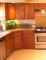 Kitchen, kitchen sink, tables, chairs, home appliances, kitchen lighting, doors, windows